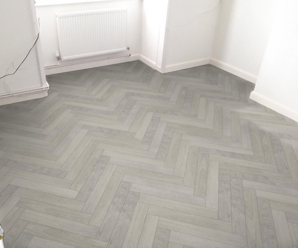 Grey herringbone LVT flooring laid by Holmes Interior Flooring, Essex